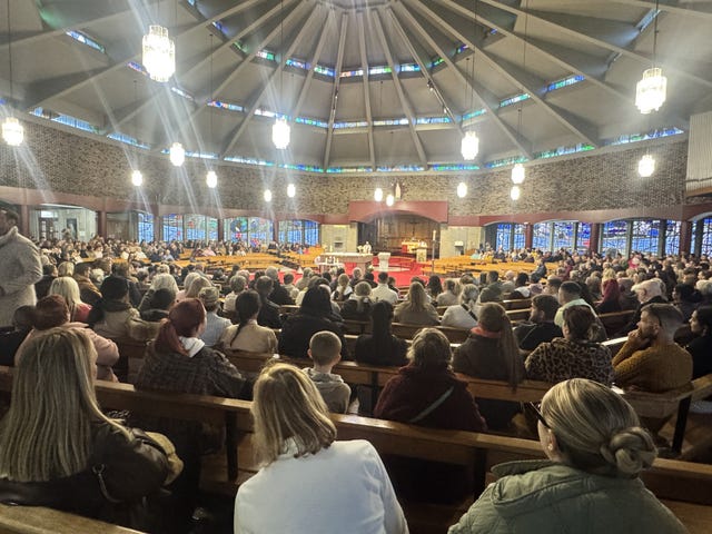 People attended a vigil at Sacred Heart Church