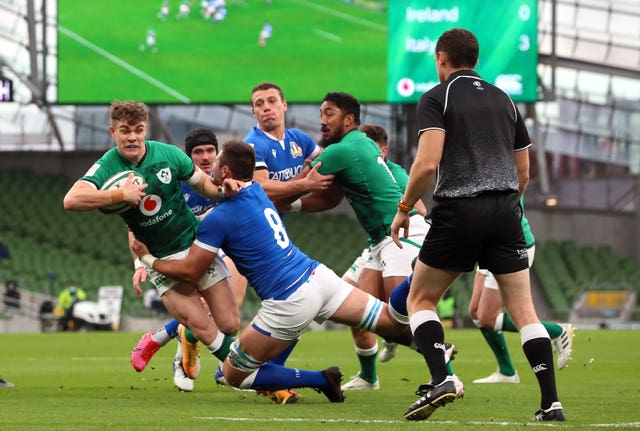 Garry Ringrose is tackled by Italy's Jake Polledri at the Aviva Stadium