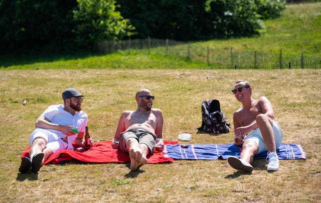 People enjoy the hot weather in Greenwich Park, London (Dominic Lipinski/PA Wire)