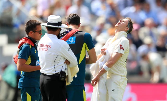Steve Smith, right, receives treatment at Lord's