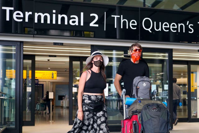 Passengers arrive at Terminal 2 at Heathrow Airport