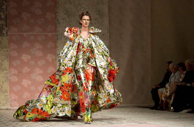 A model takes to the catwalk as part of the Richard Quinn Autumn/Winter 2018 London Fashion Week show (Isabel Infantes/PA)