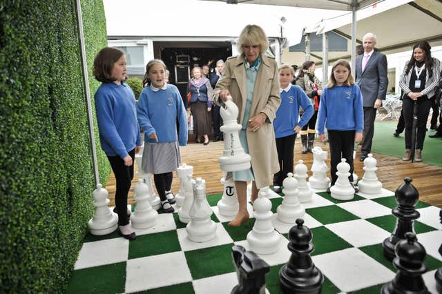The Duchess of Cornwall plays a game of outdoor chess at the Hay Festival in 2013