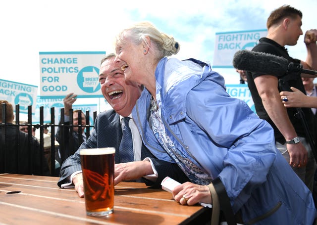 Nigel Farage with Aileen Kelly, 74, at the Moon and Starfish pub in Clacton 
