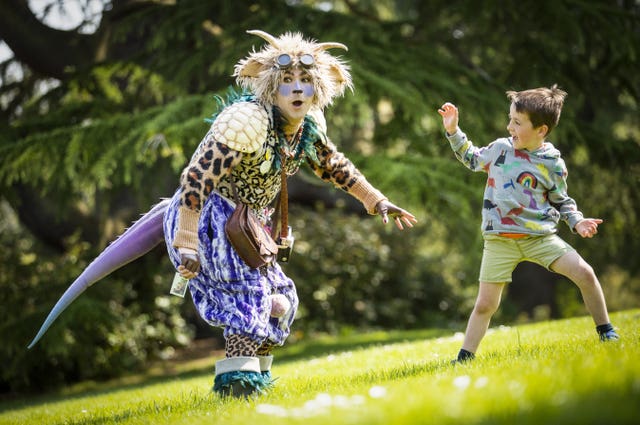 Hamish Lamont, aged five, meets 'The Undiscovered Creature' during a performance at the Royal Botanic Garden Edinburgh for the 2021 Edinburgh International Children’s Festival