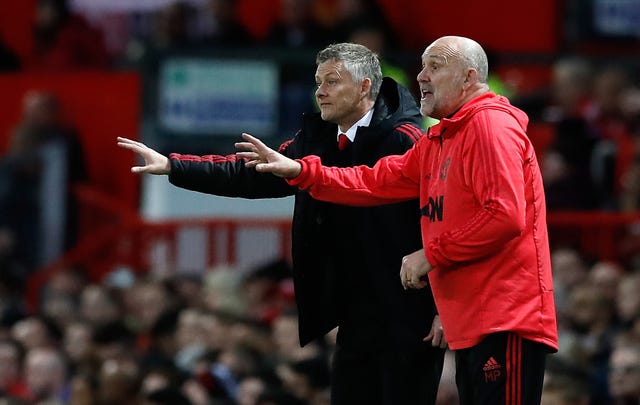 Mike Phelan (right) signed a new deal last week