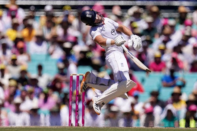 England's Jacob Bethell is hit on the head