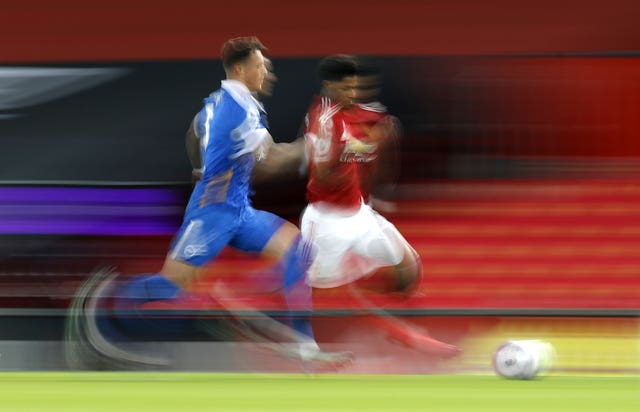 Manchester United forward Marcus Rashford outsprints Brighton's Ben White 