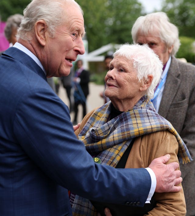 Charles greeting Dame Judi Dench