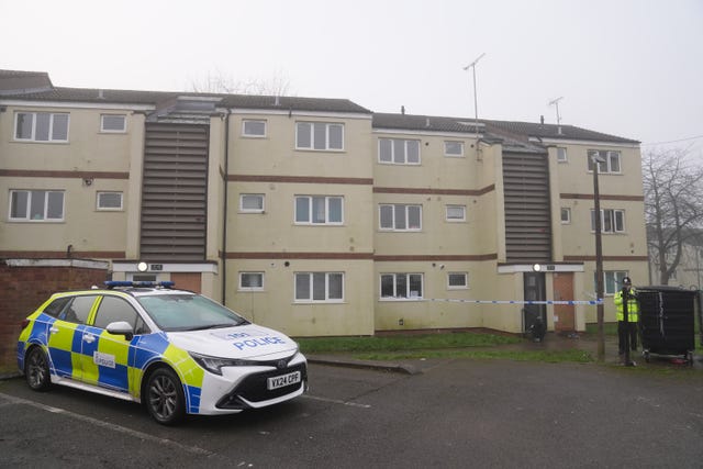 A police car outside a block of flats