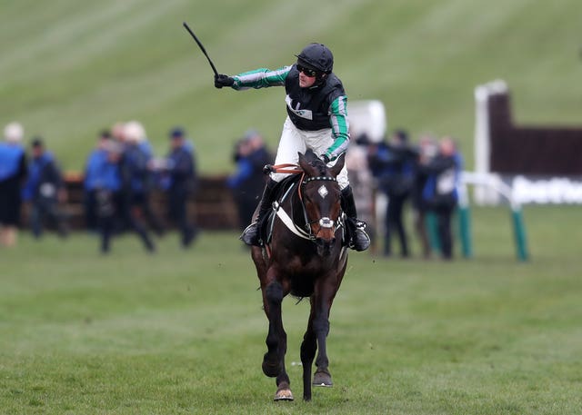 Nico de Boinville celebrates victory with the mighty Altior at Cheltenham