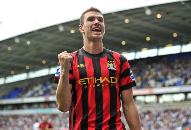 Edin Dzeko celebrates scoring for Manchester City