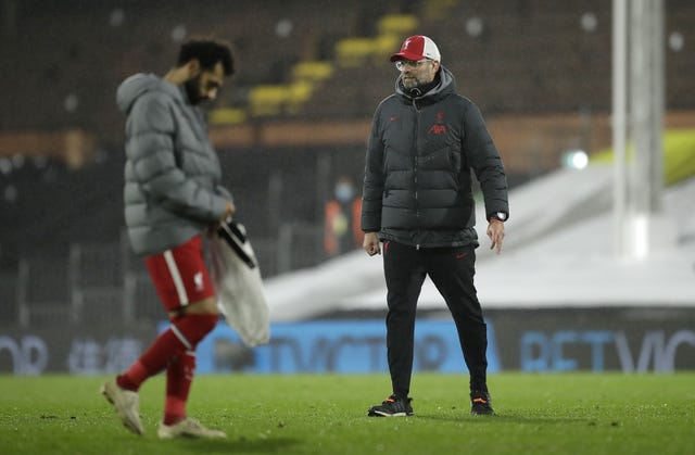 Jurgen Klopp looks on as Mohamed Salah leaves the field