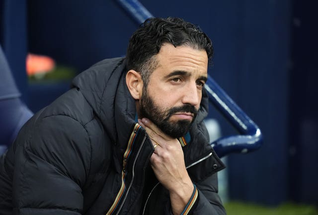 Ruben Amorim looks worried on the Manchester United bench against Manchester City