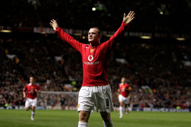 Wayne Rooney celebrates scoring a hat-trick on his United debut