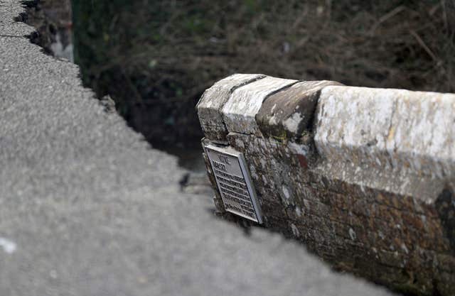 A plaque on the damaged old Wool Bridge (Andrew Matthews/PA)