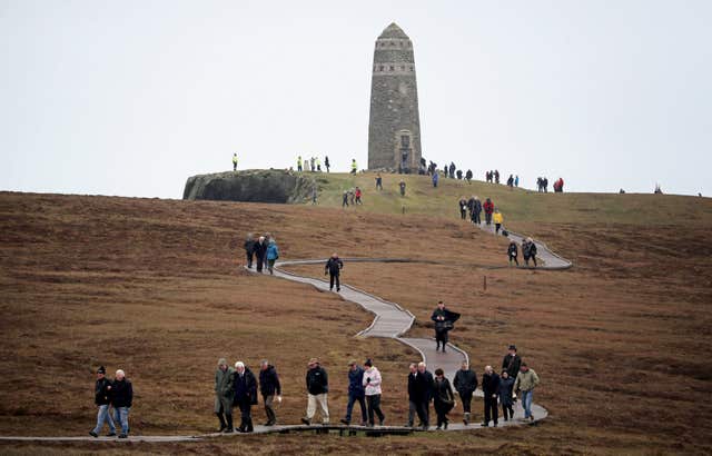 People leave after a service at the American Moment at the Mull of Oa on Islay (PA/Jane Barlow)