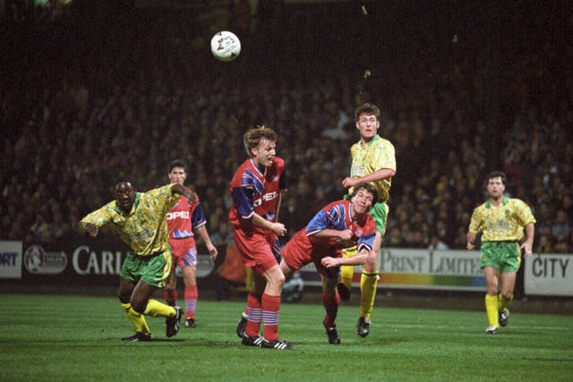 Chris Sutton (centre) in action for Norwich against Bayern Munich. (PA)
