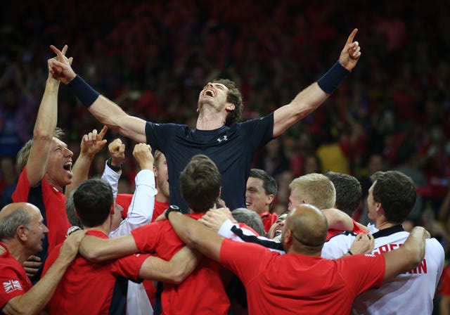 Andy Murray is held aloft by team-mates as they celebrate winning the Davis Cup