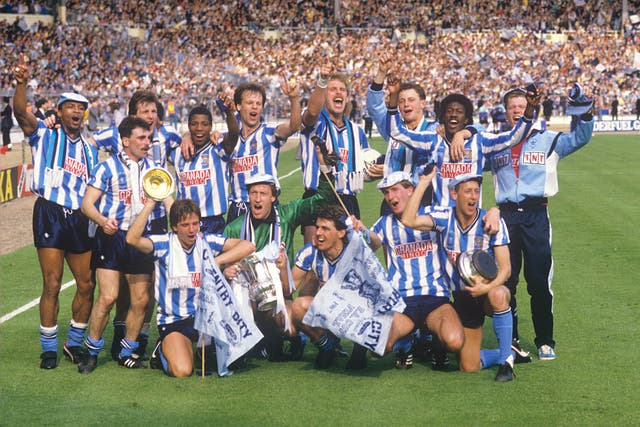 Regis, back left, celebrated the famous win with his team-mates on the hallowed Wembley turf