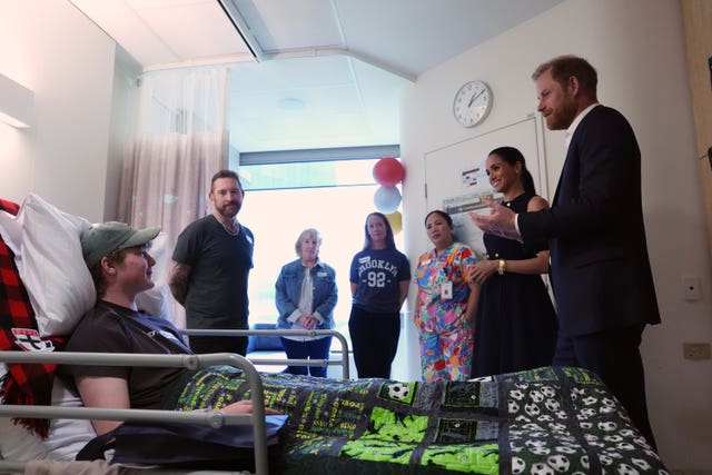 The Duke and Duchess of Sussex meet patient Hamish and family members on the Adolescent Oncology and Rehabilitation ward during a visit to the Royal Children’s Hospital Melbourne