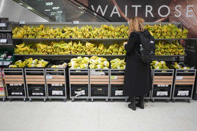 A shopper in a Waitrose store in Canary Wharf, east London