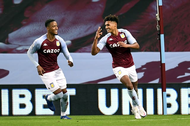 Ollie Watkins, right, celebrates his hat-trick against Liverpool