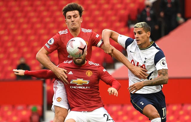 Harry Maguire, left, was run ragged by Spurs last week