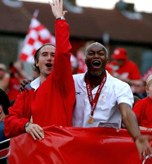 Liverpool’s Harry Kewell celebrates with Djibril Cisse on the Champions League trophy parade