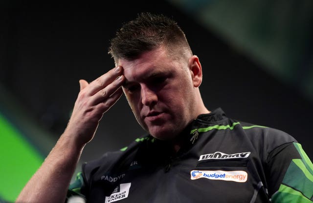 Daryl Gurney reacts on stage