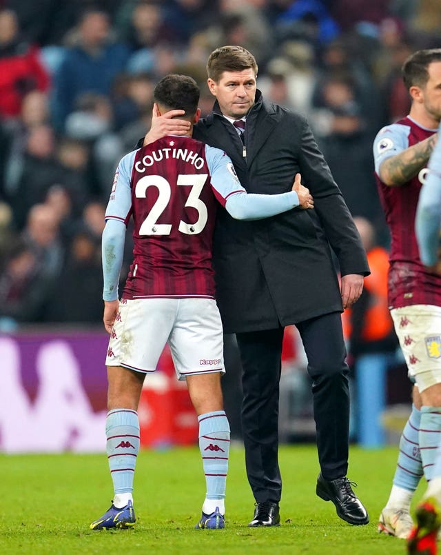 Steven Gerrard (right) hugs Philippe Coutinho