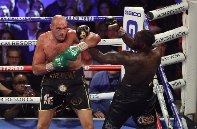 Tyson Fury, left, is committed to a third fight against Deontay Wilder (Bradley Collyer/PA)