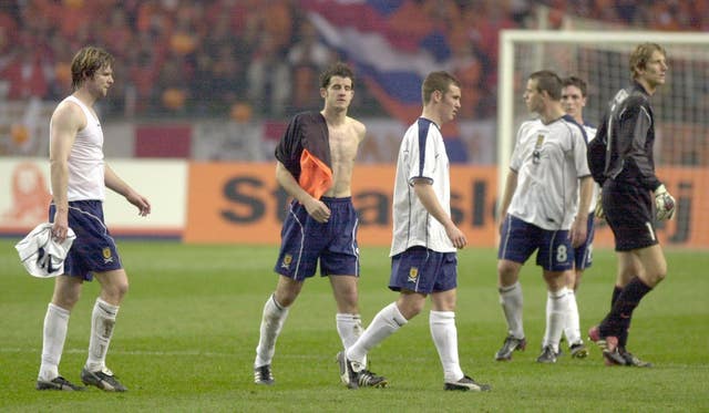 The dejected Scotland players trudge off after losing 6-0 to Holland