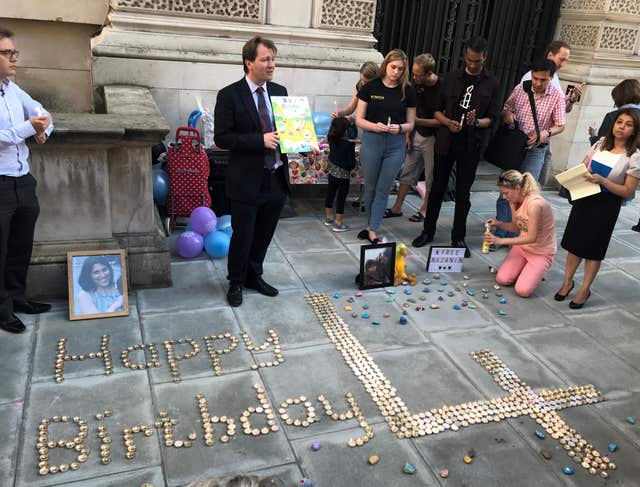 Campaigners spell out birthday messages outside the Iranian Embassy