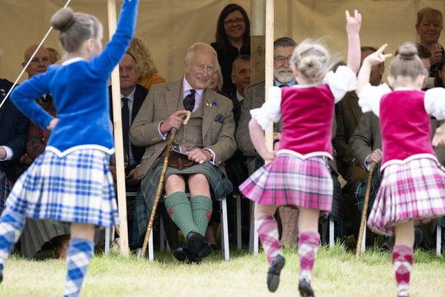 Charles watches dancers at the Mey Highland Games