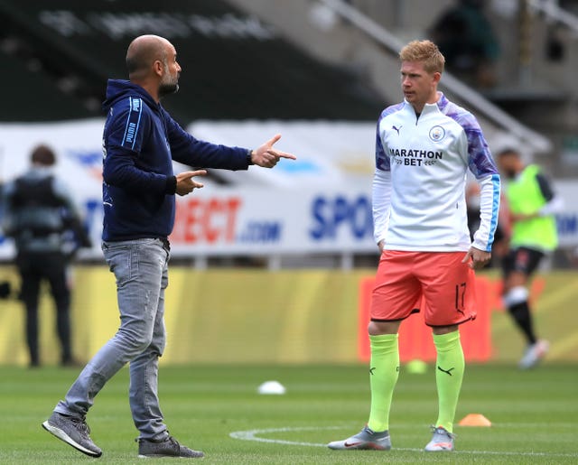 Pep Guardiola, left, will be without Kevin De Bruyne, right, for a number of weeks (Owen Humphreys/NMC Pool/PA)