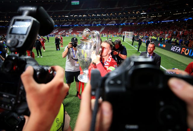 Jordan Henderson kisses the Champions League trophy
