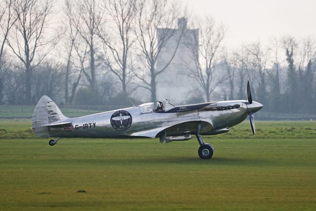 The IWC MK IX Silver Spitfire lands at Goodwood Aerodrome after British pilots Steve Brooks and Matt Jones successfully circumnavigated the globe in the newly restored Spitfire
