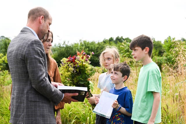 The prince meeting local school pupils during a visit to the Apricot Centre