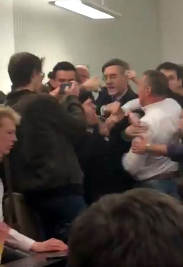 Handout still, taken with permission, from footage posted on the twitter feed of @chloekayex showing Tory MP Jacob Rees-Mogg being caught in the middle of a scuffle at the University of the West England, in Bristol. (@chloekayex)