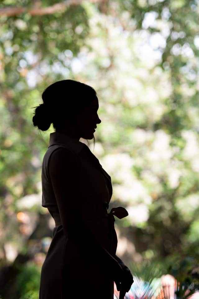 The Duchess of Sussex waits to speak onstage