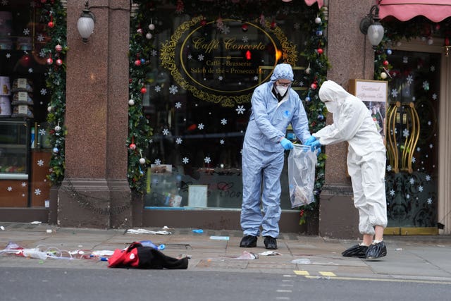 Forensic investigators at the scene on Shaftesbury Avenue in central London on December 25 2024