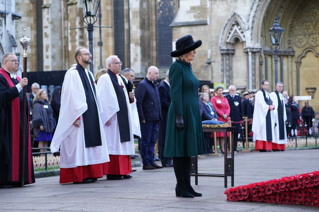 The Duchess of Cornwall observes a two-minute silence to remember the war dead on Armistice Day during a visit to the 93rd Field of Remembrance at Westminster Abbey in London, which has been held in the grounds of the abbey since November 1928