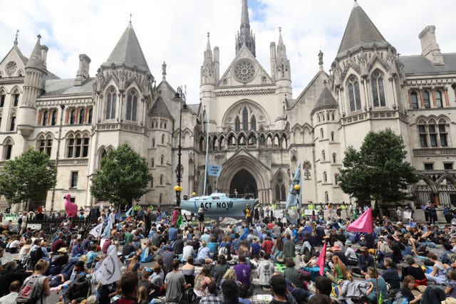 Protesters from Extinction Rebellion outside the Royal Courts of Justice in London