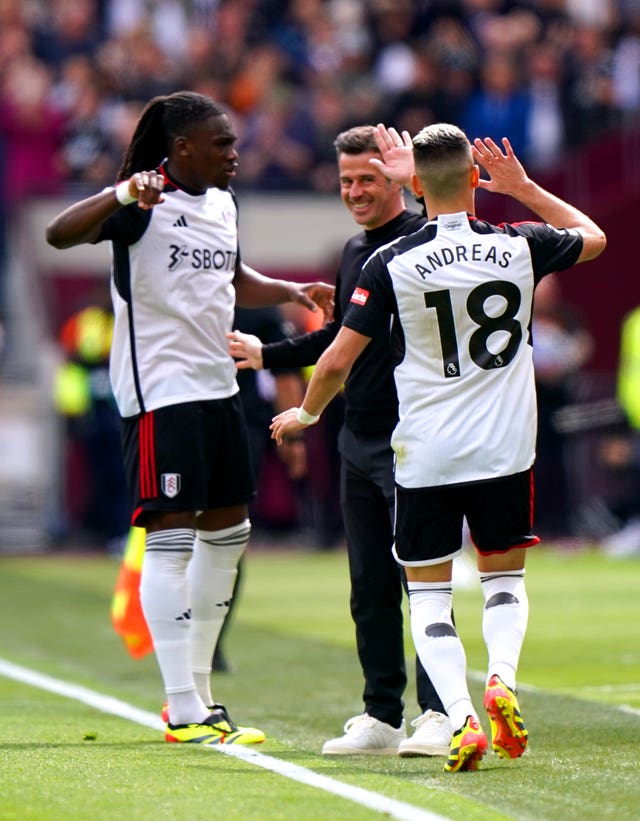 Fulham manager Marco Silva, centre, celebrates with Andreas Pereira, right, and Calvin Bassey after Pereira’s first goal against West Ham