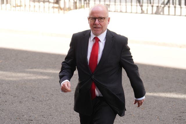 Lord Richard Hermer walking outside