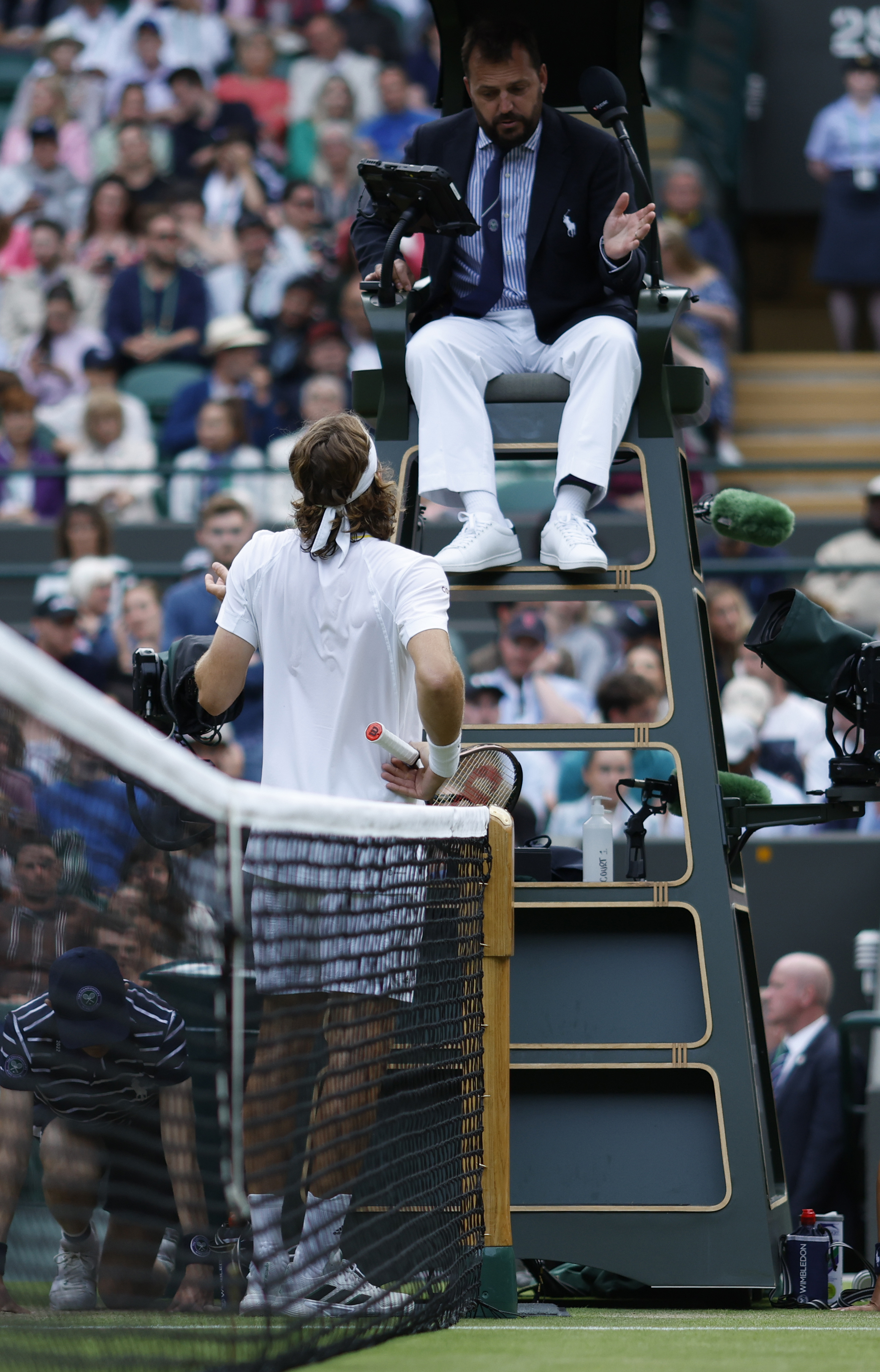Stefanos Tsitsipas speaks to the umpire