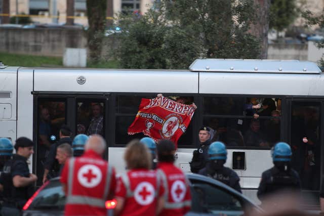 Liverpool fans arrive by shuttle bus (Steve Parsons/PA)