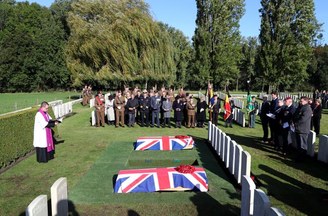 Father Patrick O’Driscoll leads a burial service at the Commonwealth War Graves Commission’s Wytschaete Military Cemetery, near Ypres