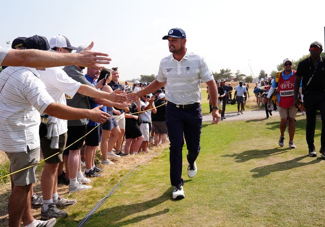 Bryson DeChambeau greets fans at The Open